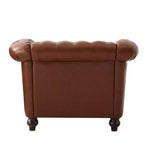 Poltrona Chesterfield Club con braccioli arrotolati, borchie e gambe in legno massello